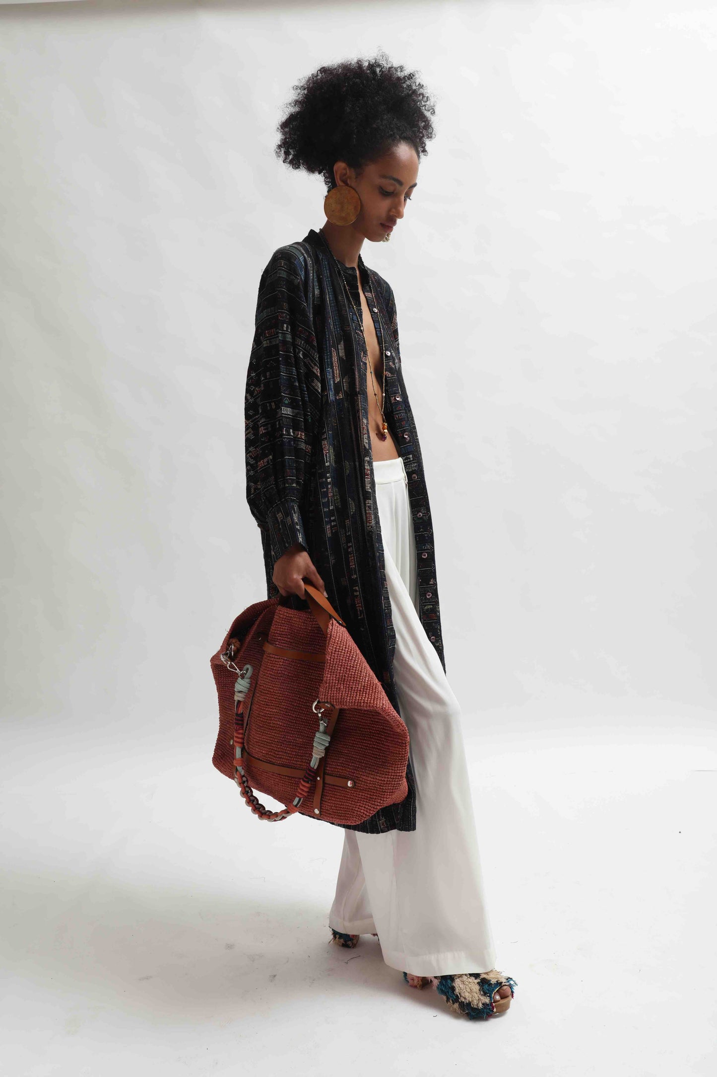 Lightweight Ajrakh Balloon Long Jacket handcrafted by Paiwand in India. Made from upcycled textile scraps with a unique leno weave and traditional handblock prints. Sustainable, ethical fashion blending heritage and innovation.