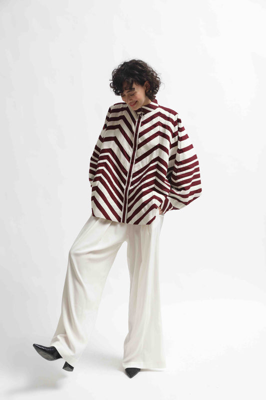 Ka-Sha Bat Shirt: hand-dyed cotton, reversible pattern, appliqué details. Versatile, sustainable artisan fashion from House of Woven Stories.