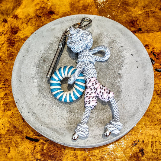 Charlie Keyring by MY BOB, a 20 cm handmade macramé accessory inspired by 70s style, crafted in Italy. Adds a colorful, personal touch to bags or keys. Comes with a soft cotton pouch.