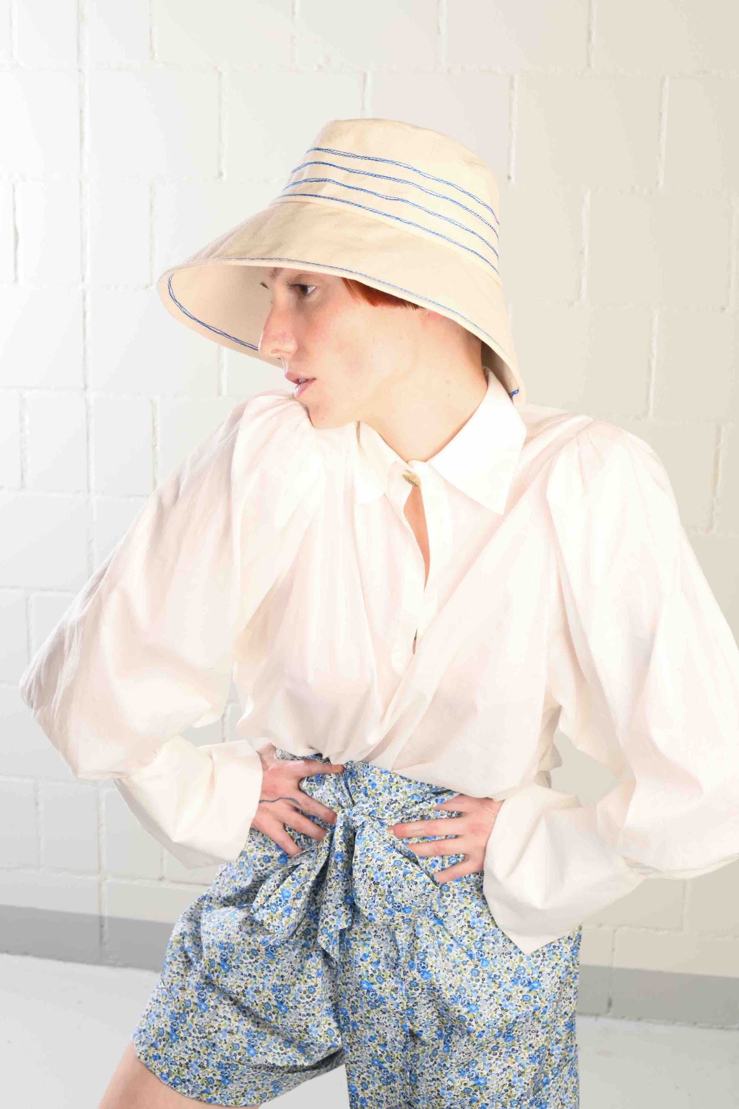 Cobalt blue stitched canvas bucket hat by Lola Hats, handmade from sail canvas with a medium brim and flexible design. Available at House of Woven Stories.