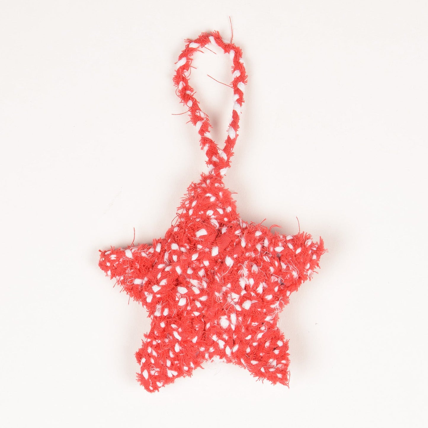 Red and white handcrafted star-shaped hanging charm made from upcycled fabric by SilaiWali.