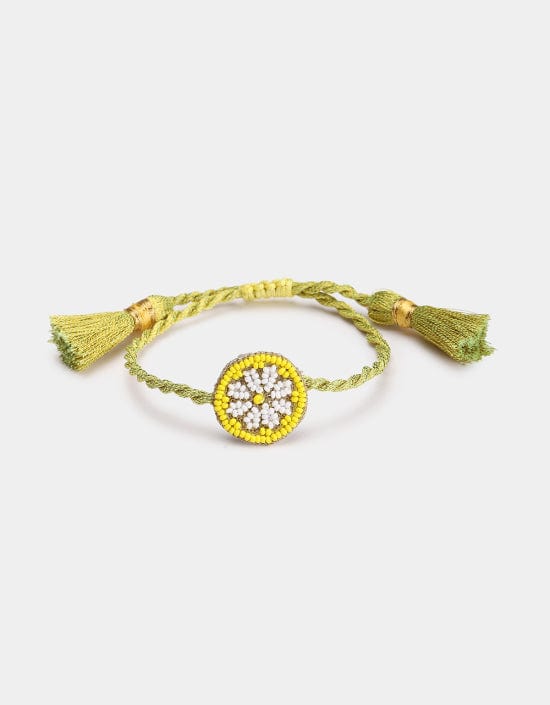 Hand-beaded Lemon Slice bracelet with handmade tassels from Olivia Dar’s Fruit Punch collection, crafted in New Delhi with sustainable materials.