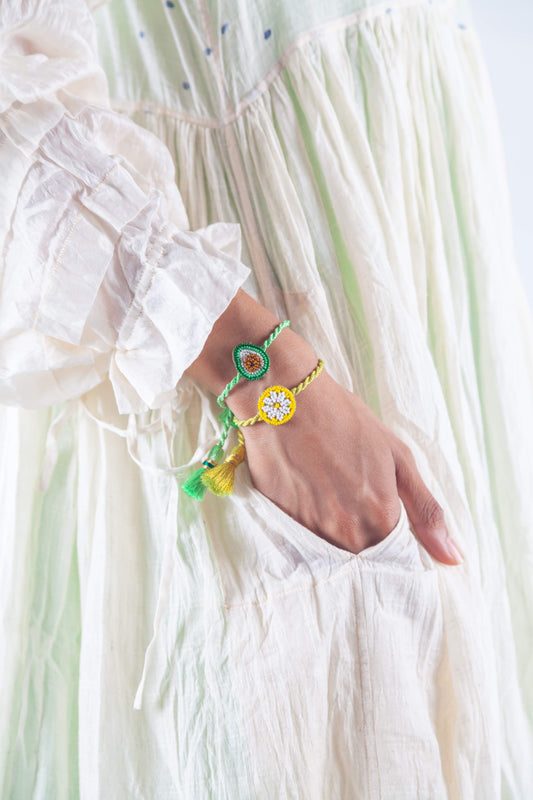 Hand-beaded Lemon Slice bracelet with handmade tassels from Olivia Dar’s Fruit Punch collection, crafted in New Delhi with sustainable materials.