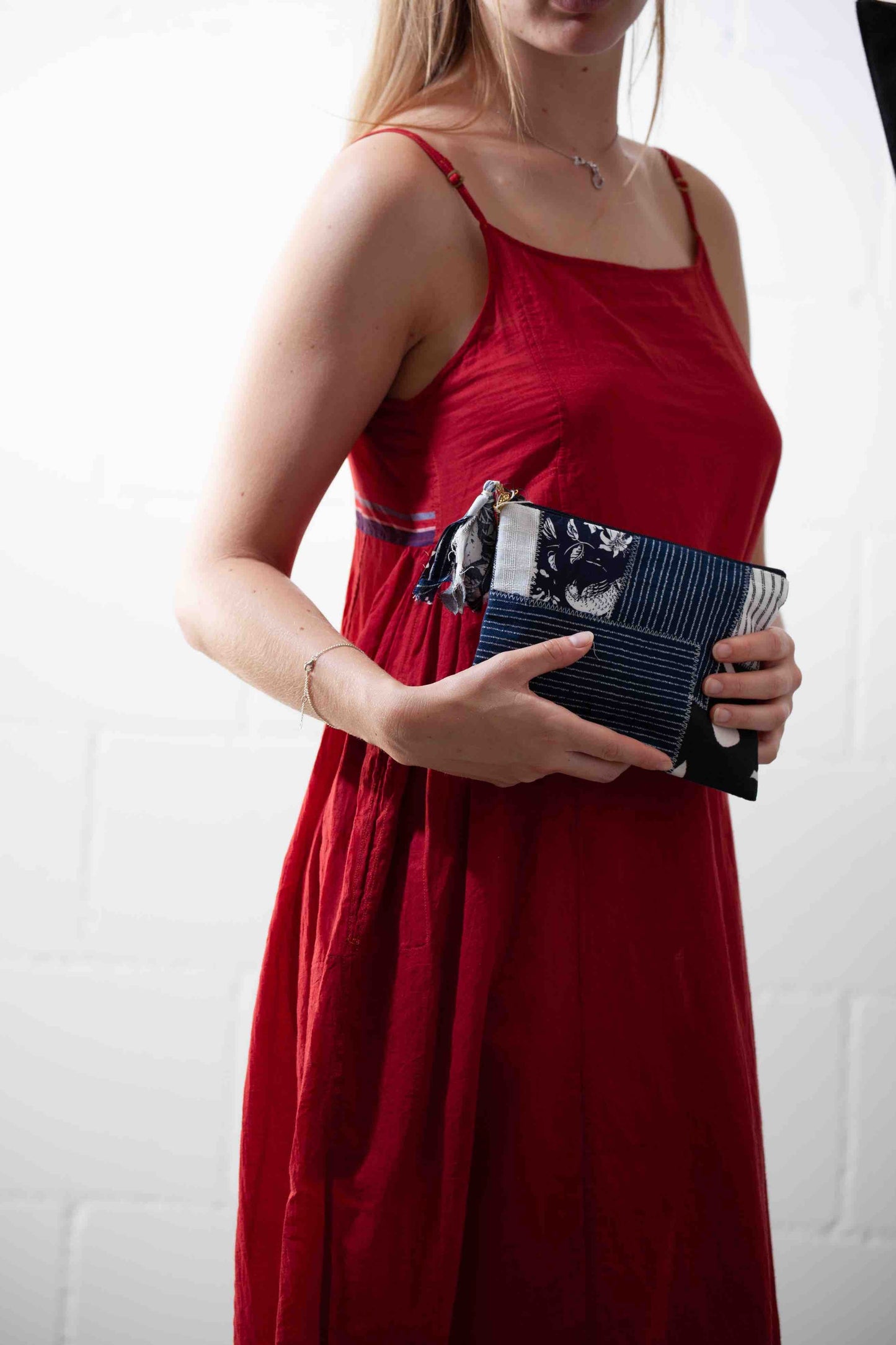 Handcrafted vanity pouch by SilaiWali made from upcycled fabric, stitched by Afghan refugee women for sustainable living.