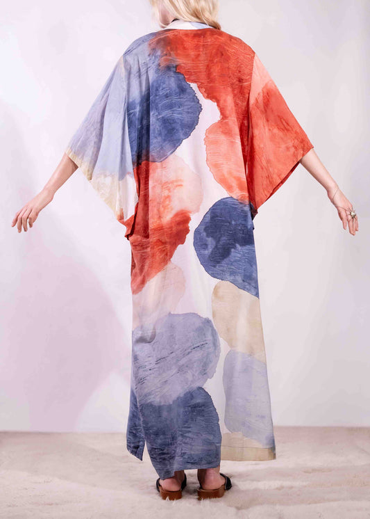 Model wearing a lightweight, hand-painted cotton tunic by Agave Textiles, featuring a flowing one-size fit. Made in Argentina, part of the House of Woven Stories selection.