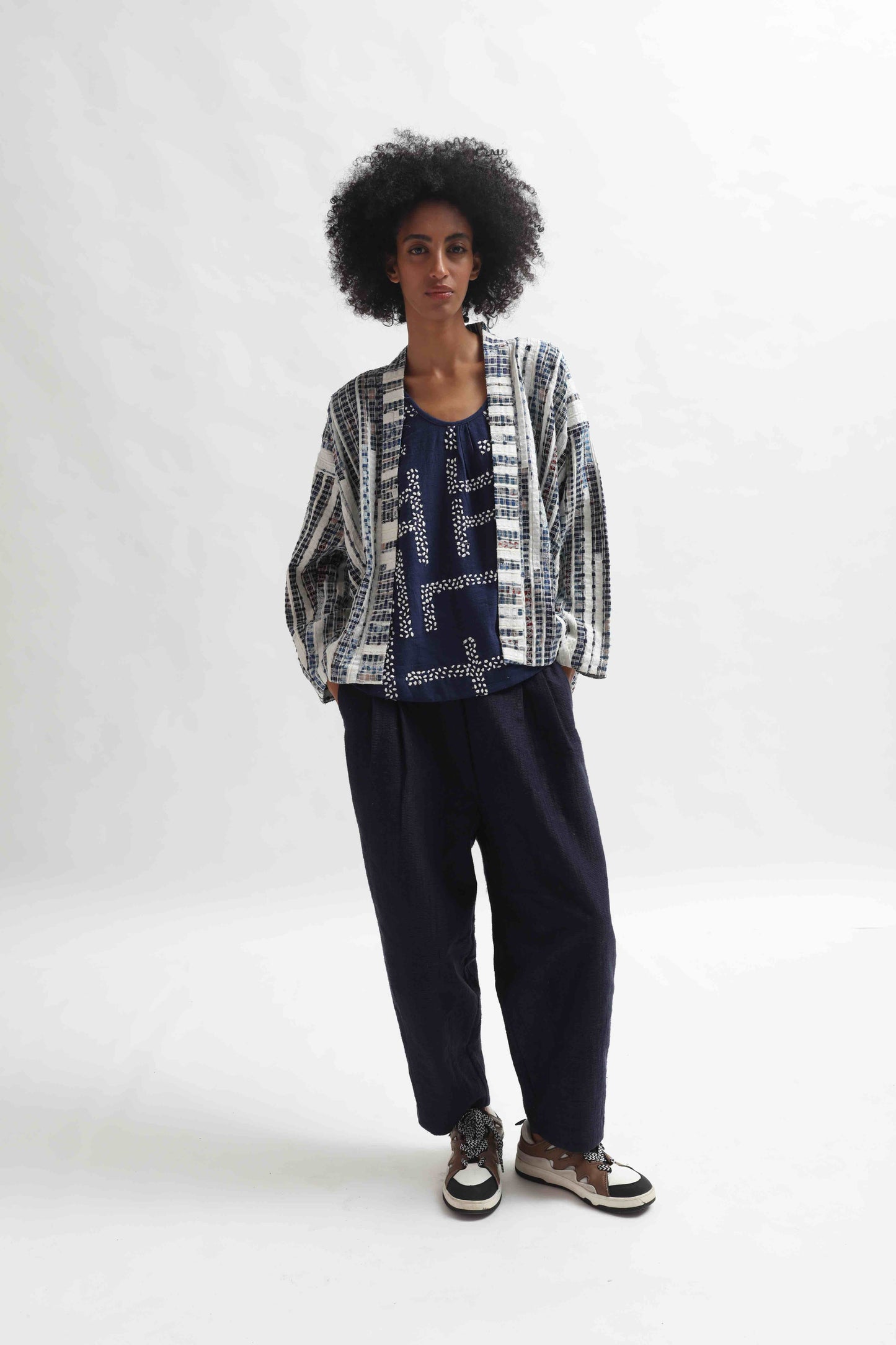 Indigo embroidered top by Paiwand made from organic indigo-dyed cotton with upcycled embroidery, ethically handcrafted in India.