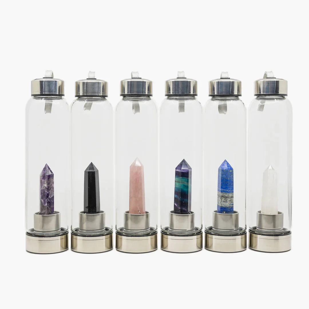 Lapis Lazuli Crystal Water Bottle by The Goddess Collective, featuring a natural crystal obelisk inside a glass bottle with stainless steel lids and carry sleeve. Available at House of Woven Stories.