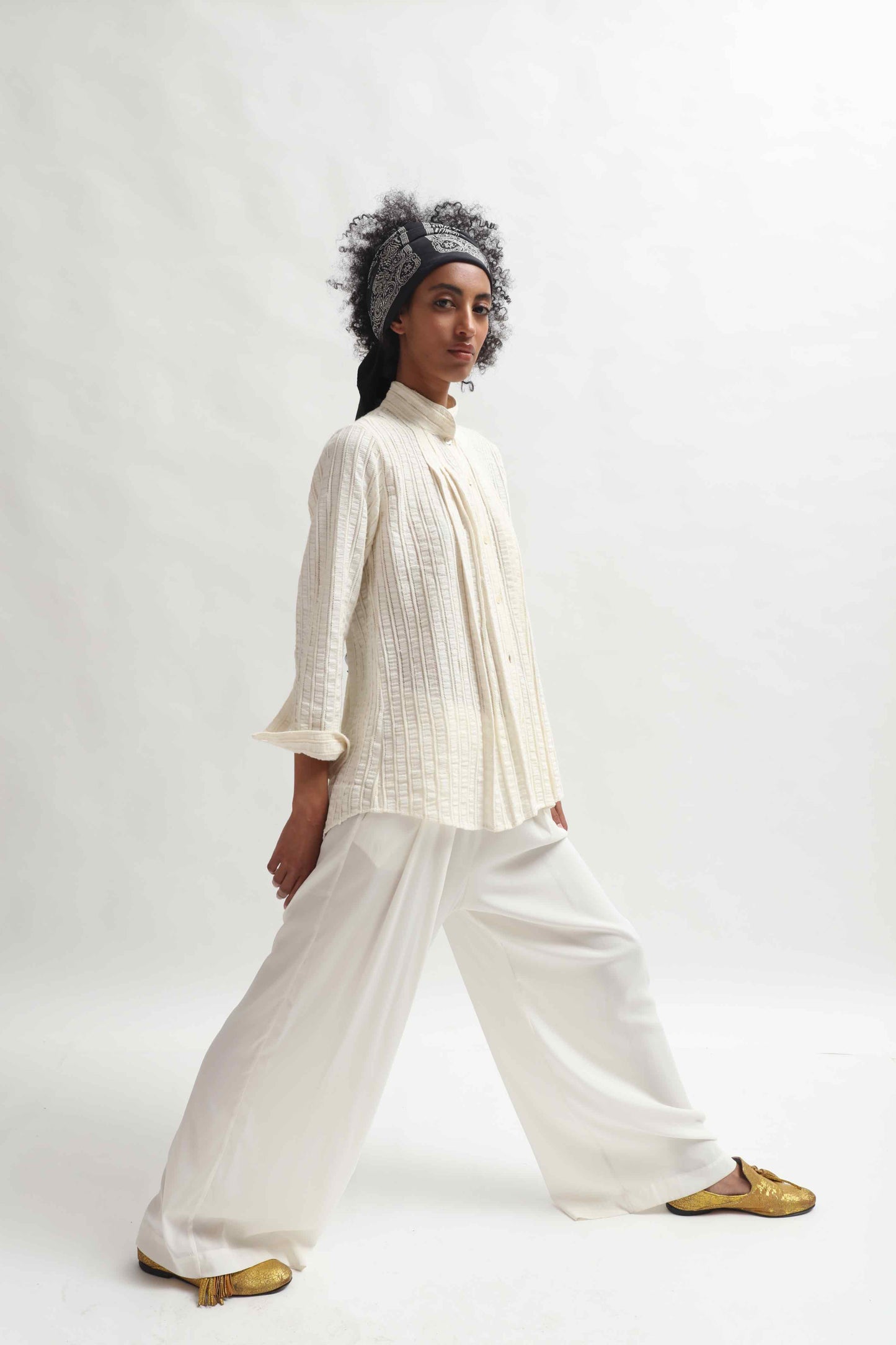 Leno Pleated Shirt by Paiwand made from upcycled cotton with breathable leno weave, featuring elegant pleats and handcrafted in India. Sustainable fashion curated by House of Woven Stories.
