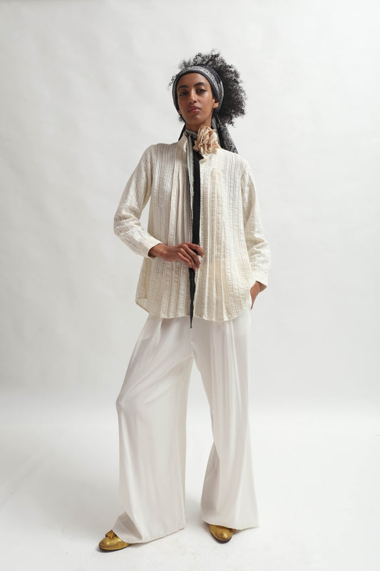 Leno Pleated Shirt by Paiwand made from upcycled cotton with breathable leno weave, featuring elegant pleats and handcrafted in India. Sustainable fashion curated by House of Woven Stories.