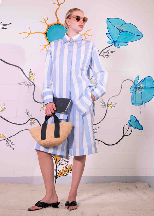 Sky-blue and white striped organic cotton bermuda shorts with pleats and side pockets, handmade in Italy by House of Woven Stories.