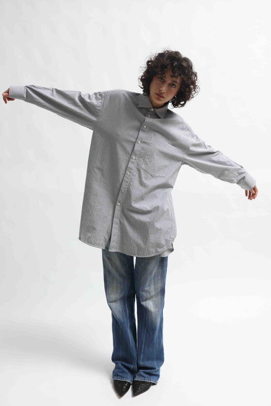 Crisp 100% organic cotton shirt with classic collar and marine blue and white stripes, handcrafted by House of Woven Stories in Italy’s Piedmont region, featuring a soft paper-touch finish and relaxed fit for versatile, refined style.