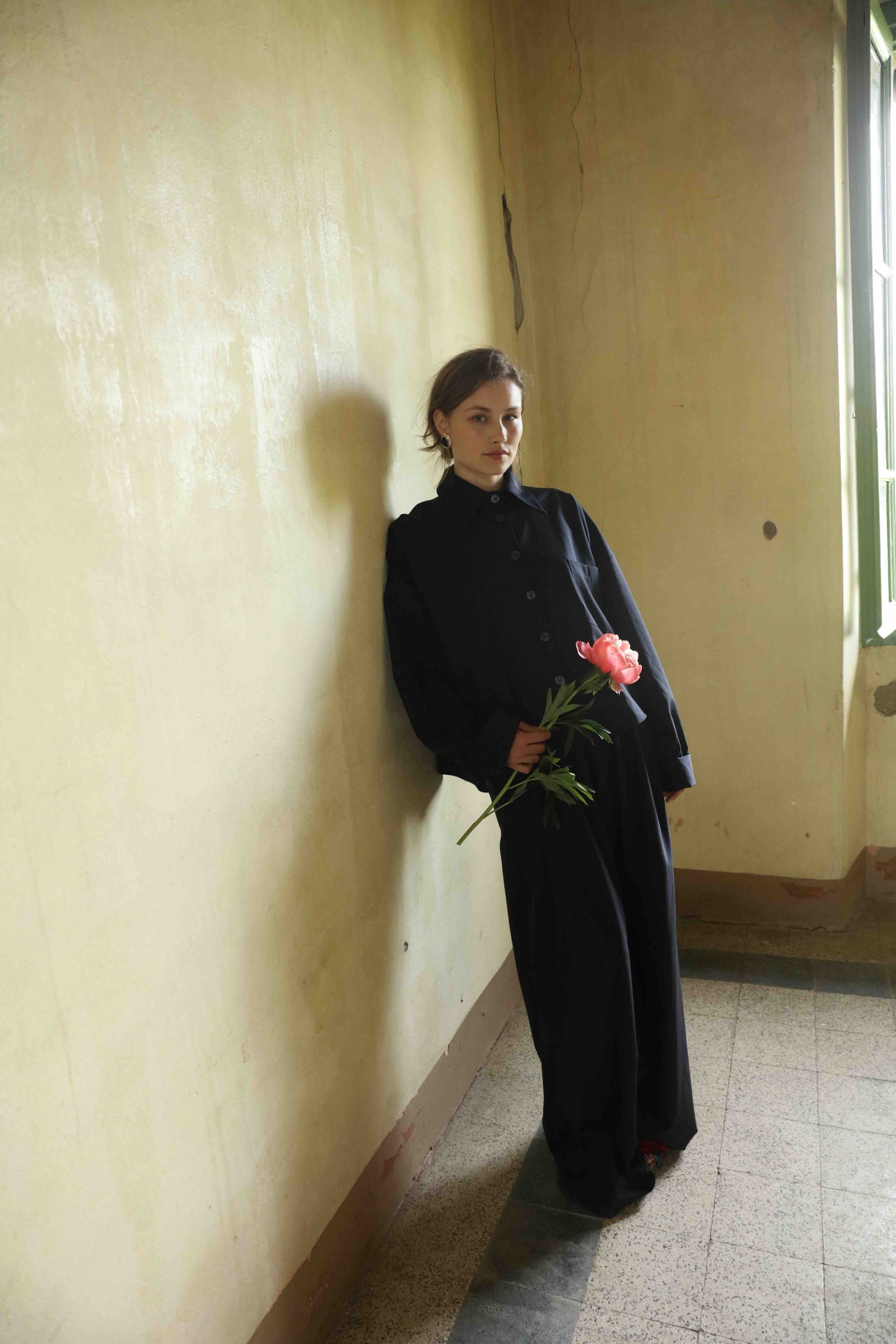 Wide-leg cool wool trousers in 100% Super 100 Pure Merino Wool with elastic waistband and front pleats, handmade in Italy by House of Woven Stories, shown in Anthracite.