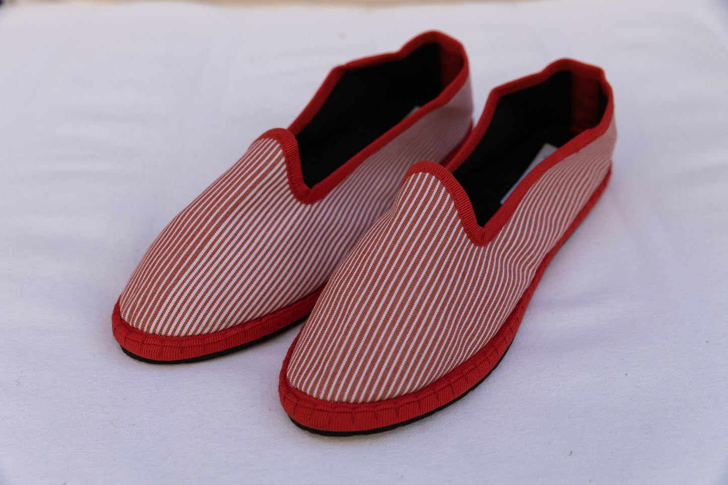 Red White Striped Venetian Slippers by Teod’amar, handmade in Venice from upcycled luxury fabrics and recycled bicycle tyres. Unique, eco-conscious, and timelessly elegant.