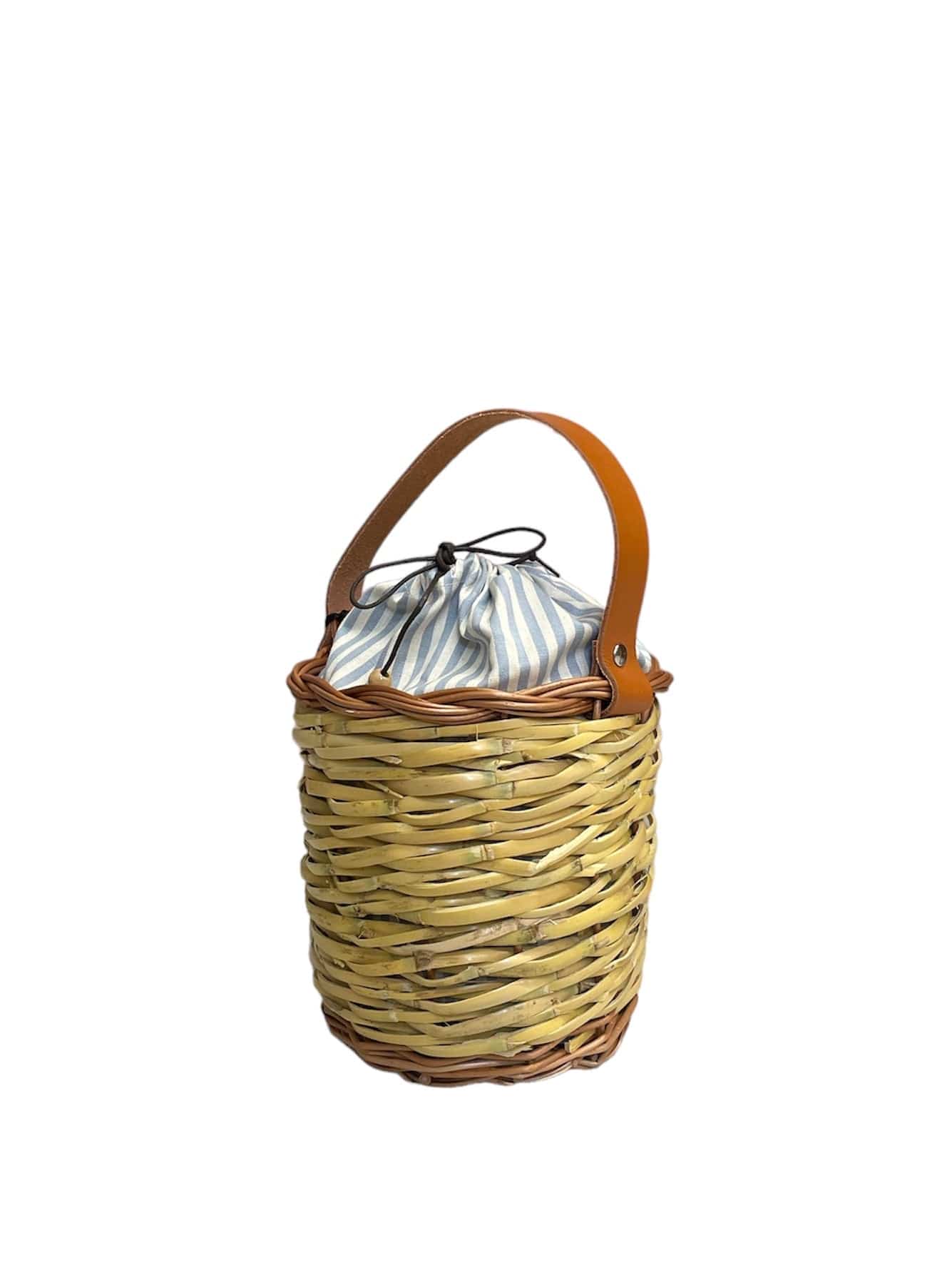 Sky Mini Panier small handwoven basket bag made from dried bamboo reeds and wimini, featuring a leather handle and cotton lining, crafted by Micaela Spadoni in Italy.