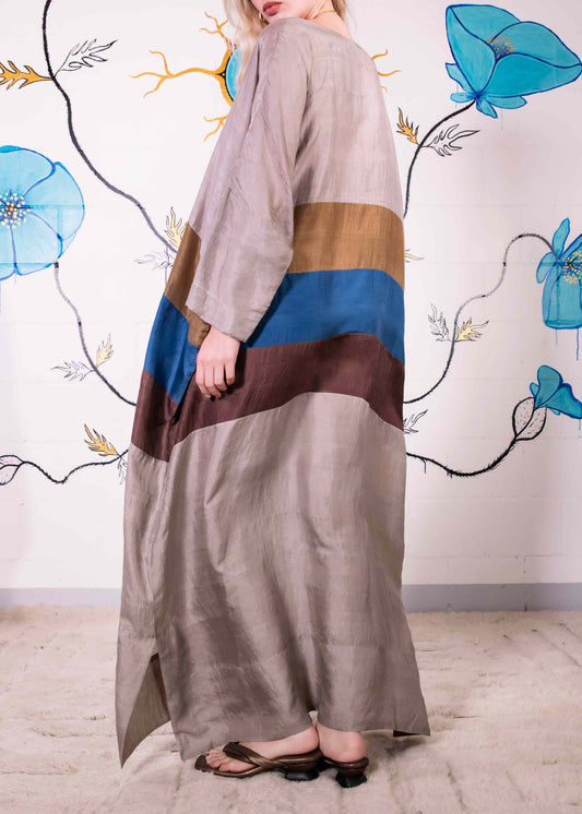 Ankle-length colour-blocked blouson dress by A Sacred Wrap, featuring hand-dyed botanical hues in patchwork design. Made in Mumbai from natural fibers, combining fluid silhouette with ethical craftsmanship.
