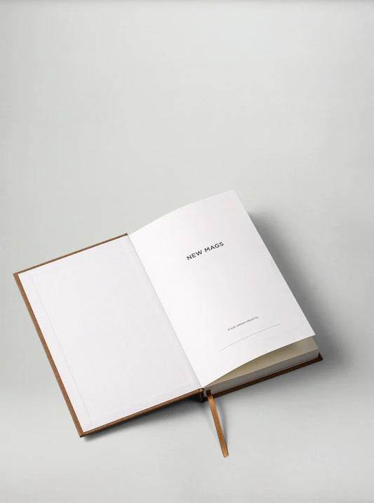 Sand Yearly Planner by New Mags, undated minimalist planner with monthly and daily pages.