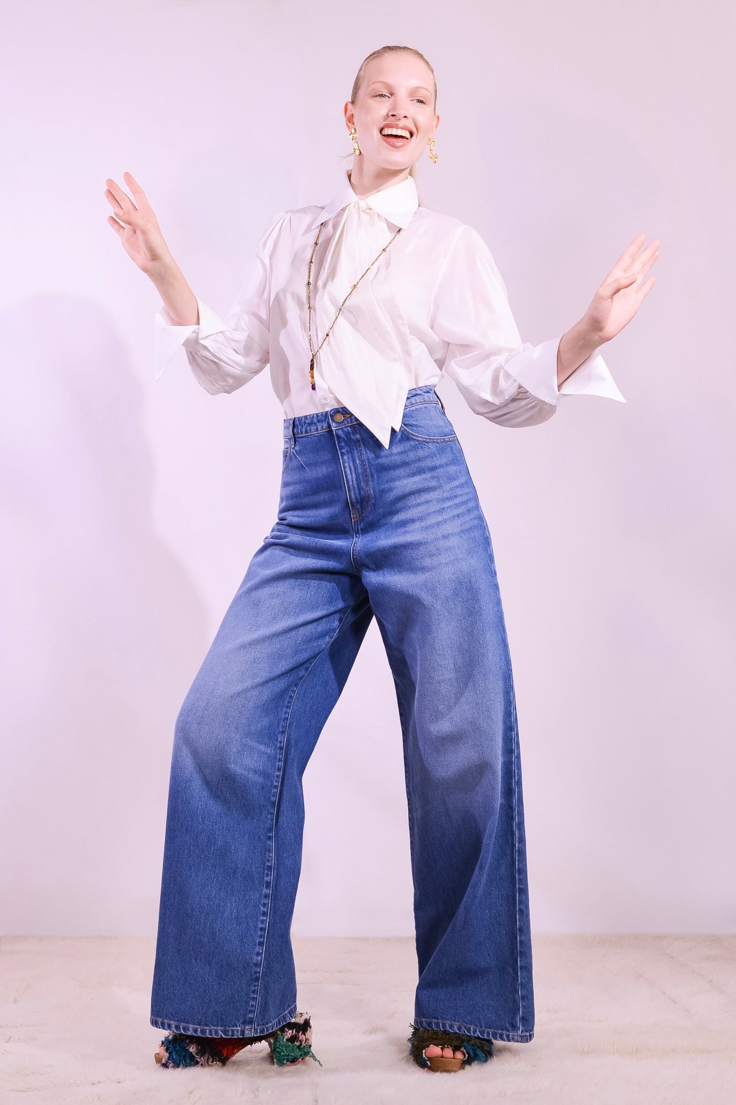 Model wearing the Karin 2 white cotton blouse handmade in Italy with removable tie by House of Woven Stories