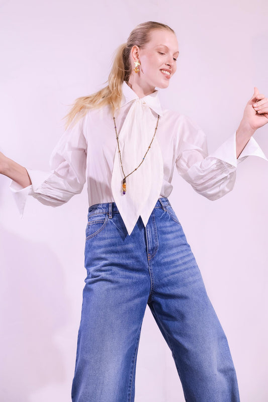 Model wearing the Karin 2 white cotton blouse handmade in Italy with removable tie by House of Woven Stories