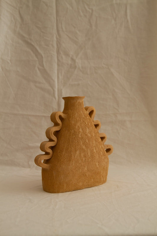 Handbuilt Amphora Soleil in sun-toned chamotte clay by Clandestine Céramique, featuring sculptural handles and a textured surface, available at House of Woven Stories.