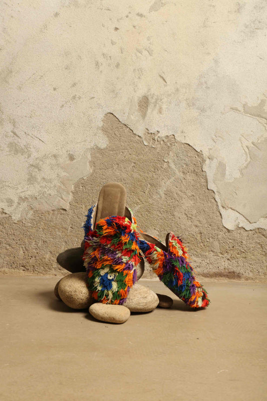 Baboush Fringed Majorel in Multicolor by House of Woven Stories, handcrafted in Marrakesh with colorful hand-tied fringe, cushioned insole, and ethically sourced leather, showcasing vibrant Moroccan craftsmanship.