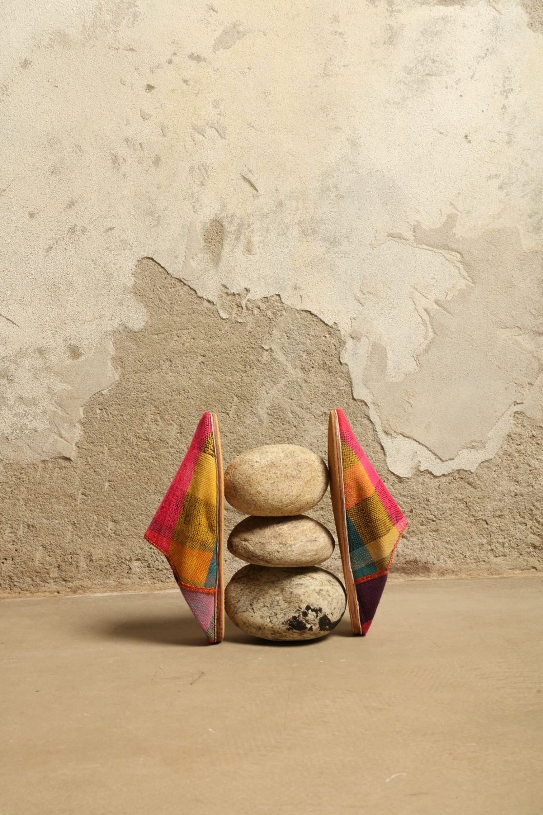 Model is wearing the Baboush in Kelim Fabric by House of Woven Stories, handmade in Marrakesh with colorful handwoven kilim textile and ethically sourced leather sole, showcasing authentic Moroccan craftsmanship.