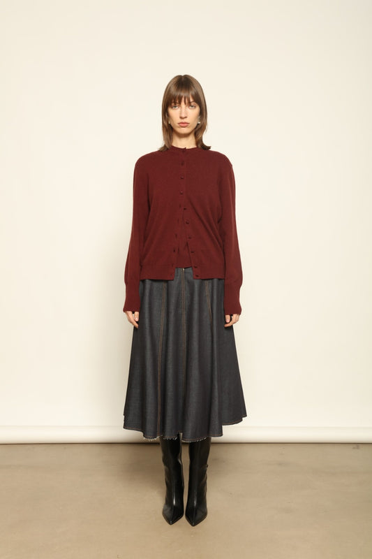 Model wearing the Burgundy Nathalie Cashmere Cardigan by House of Woven Stories, made from 100% pure Inner Mongolia cashmere, featuring a deep burgundy shade, open-front design, relaxed silhouette, flowing drape, and sustainable luxury craftsmanship