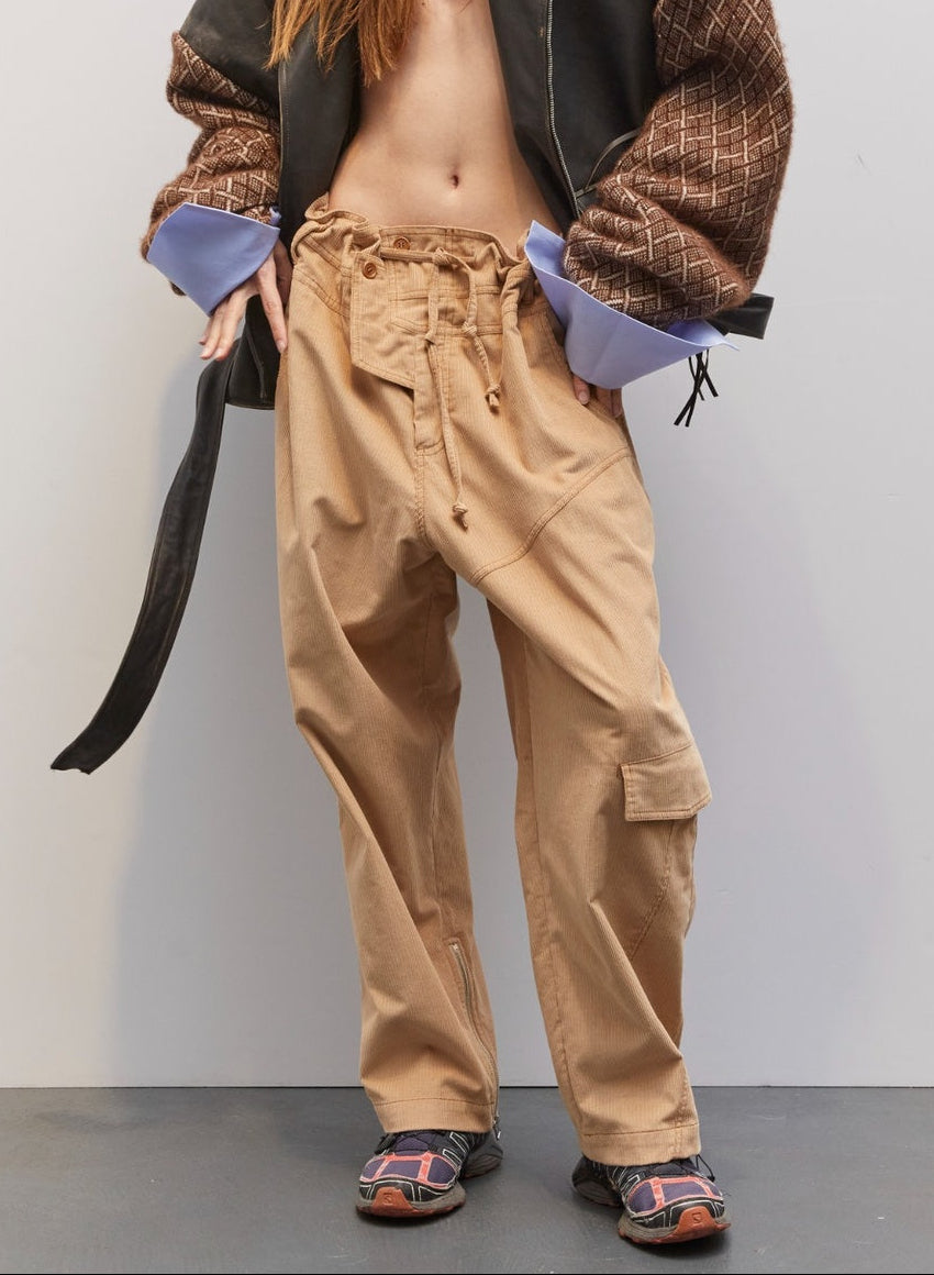 Model wearing the Carlo Dark Brown Biker Leather Pull by Maison Jejia, featuring oversized sculptural silhouette, textured leather sleeves, exaggerated cuffs, and fluid drape for a contemporary, refined biker-inspired look