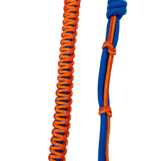 Close-up of MY BOB macramé dog leash, handmade in Italy with colorful braided design and sturdy hardware, shown attached to a harness.