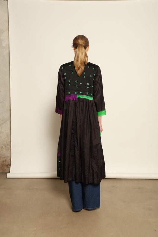 Model is wearing Folklore 10 Handmade Cotton and Silk Dress by Injiri, part of the House of Woven Stories selection, crafted in India from a cotton and silk blend with round neckline, long sleeves, side pockets, and artisanal detailing.
