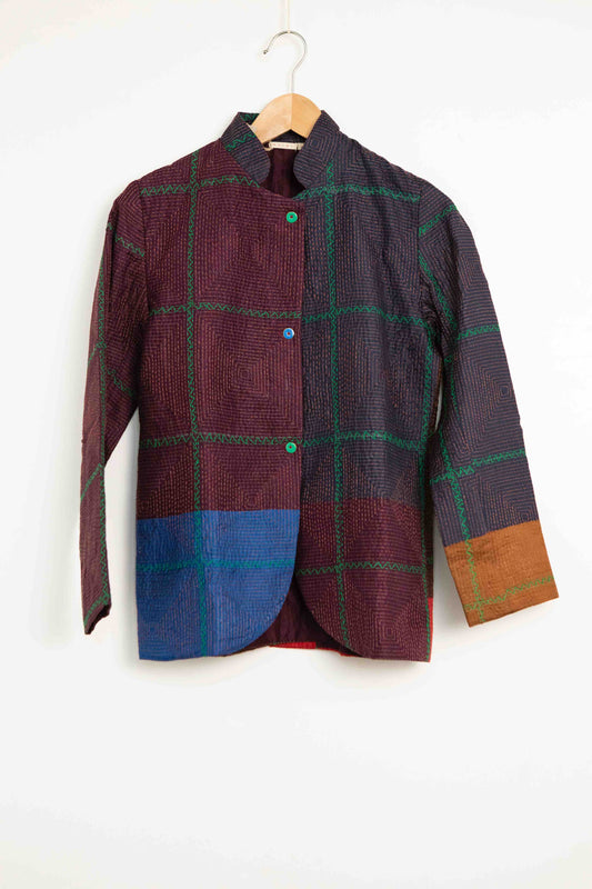 Model is wearing the Folklore 82 silk hand-loomed jacket by Injiri, featuring lightweight silk, refined tailoring, and artisanal craftsmanship, handmade in India. Part of House of Woven Stories selection.