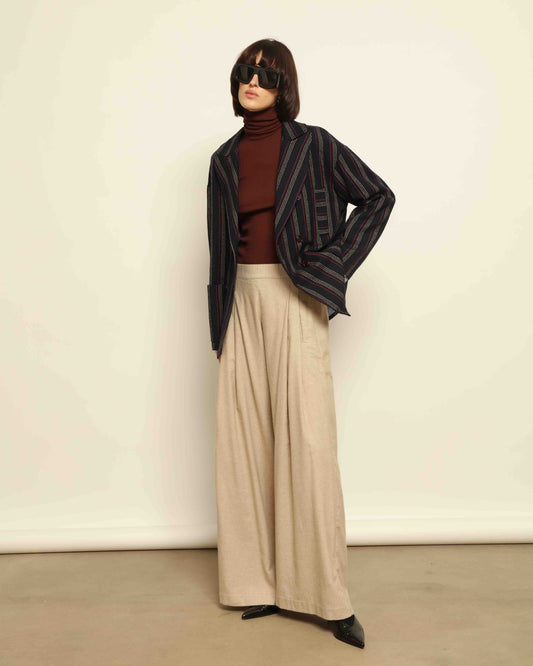 Model is wearing the Navy Blue Striped Double-Breasted Blazer by Balia 8.22, crafted in Italy from virgin wool and cotton with a structured silhouette for timeless elegance.