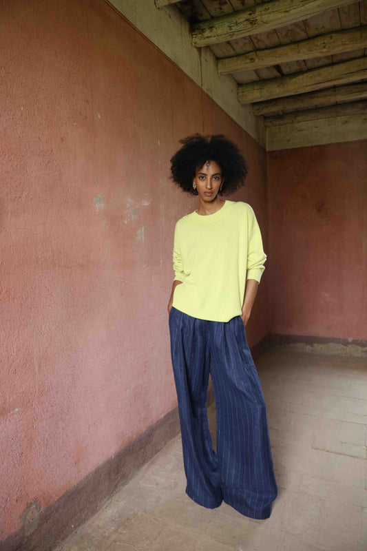 Wide-leg striped trousers in linen, wool, and silk by House of Woven Stories, featuring a mid-rise elastic waistband, front pleats, and side pockets, handmade in Italy.