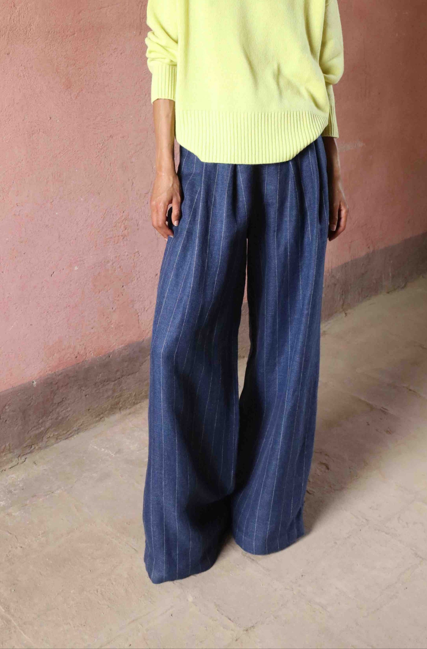 Wide-leg striped trousers in linen, wool, and silk by House of Woven Stories, featuring a mid-rise elastic waistband, front pleats, and side pockets, handmade in Italy.