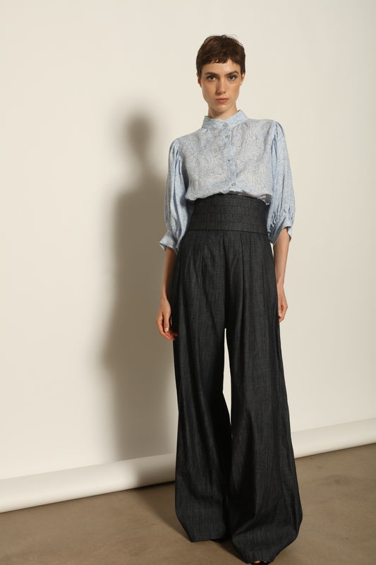 Model wearing the Sergey Night Blue Cummerbund by House of Woven Stories, featuring a structured silk-wool blend, deep night blue tone, and sculptural waist-defining silhouette.