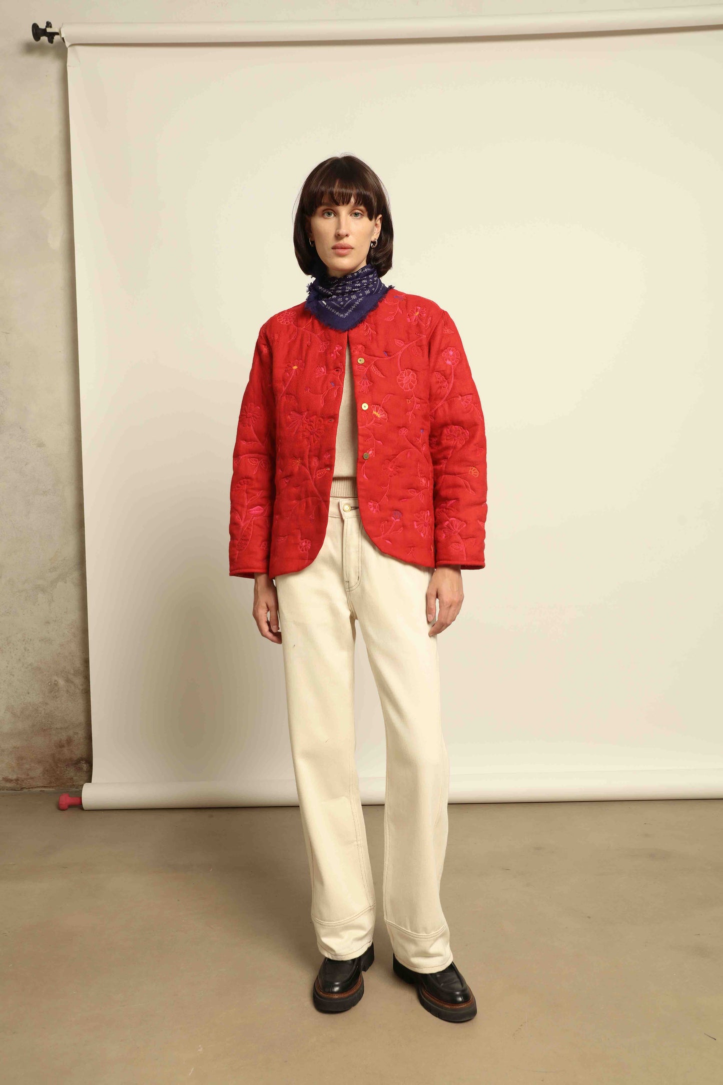 Model is wearing the Folklore 58 Jacket by Injiri, handloomed in scarlet red silk and wool with a lightweight yet structured cut, combining tradition and modern elegance.