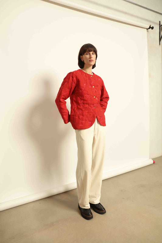 Model is wearing the Folklore 58 Jacket by Injiri, handloomed in scarlet red silk and wool with a lightweight yet structured cut, combining tradition and modern elegance.