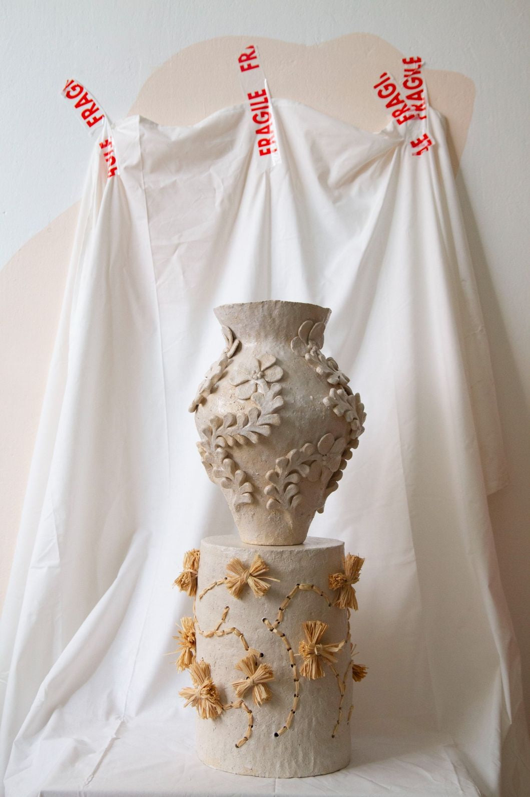 Le Jardin Blanc Side Table by Clandestine Céramique, part of the House of Woven Stories selection, handbuilt in natural clay with a glossy white glaze revealing earthy undertones.