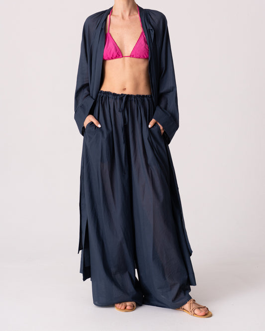 Model is wearing the Liquid Navy Cotton Pantaloons by Les Vacances d’Irina, wide-leg handmade cotton voile pants with drawstring waist and side pockets, available at House of Woven Stories.