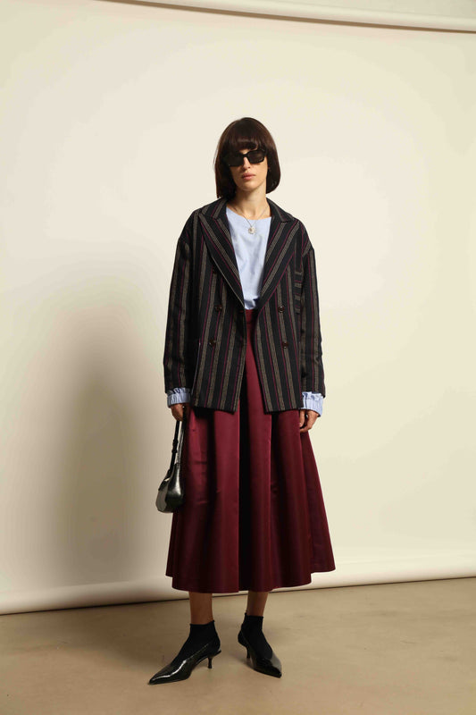 Model is wearing the Navy Blue Striped Double-Breasted Blazer by Balia 8.22, crafted in Italy from virgin wool and cotton with a structured silhouette for timeless elegance.