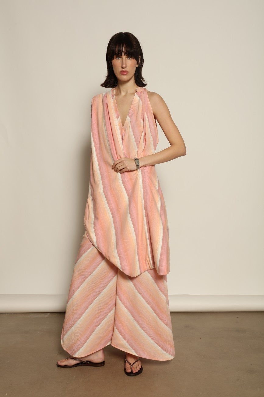 Model is wearing Marrakshi Life beach bag in handwoven cotton, lightweight spacious versatile tote from the curated selection of House of Woven Stories