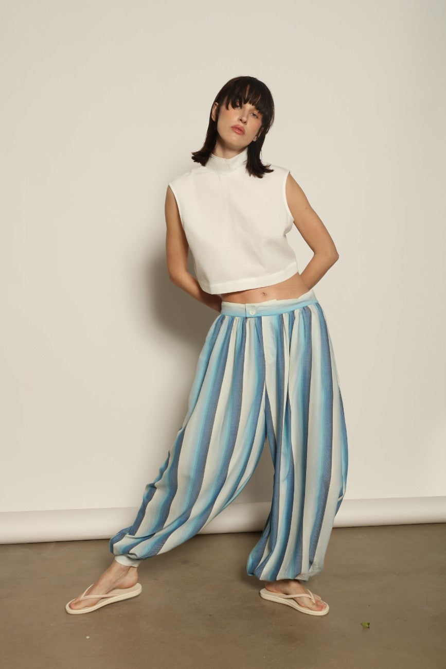 Model is wearing Marrakshi Life harem pants in striped handwoven cotton, voluminous relaxed fit lightweight breathable trousers from the curated selection of House of Woven Stories