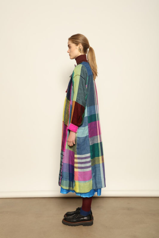 Model is wearing the Miraj 55 Pure Cashmere Dress by Injiri, crafted from the finest cashmere with bold multicolor check patterns, blending warmth, artistry, and refined elegance.