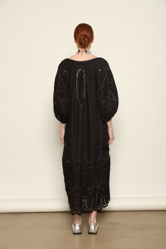 Model is wearing the My Sleeping Gypsy Merezhivo Long Dress, handcrafted from 100% linen with Richelieu embroidery and 24-carat bead accents, from the House of Nomad Stories selection.