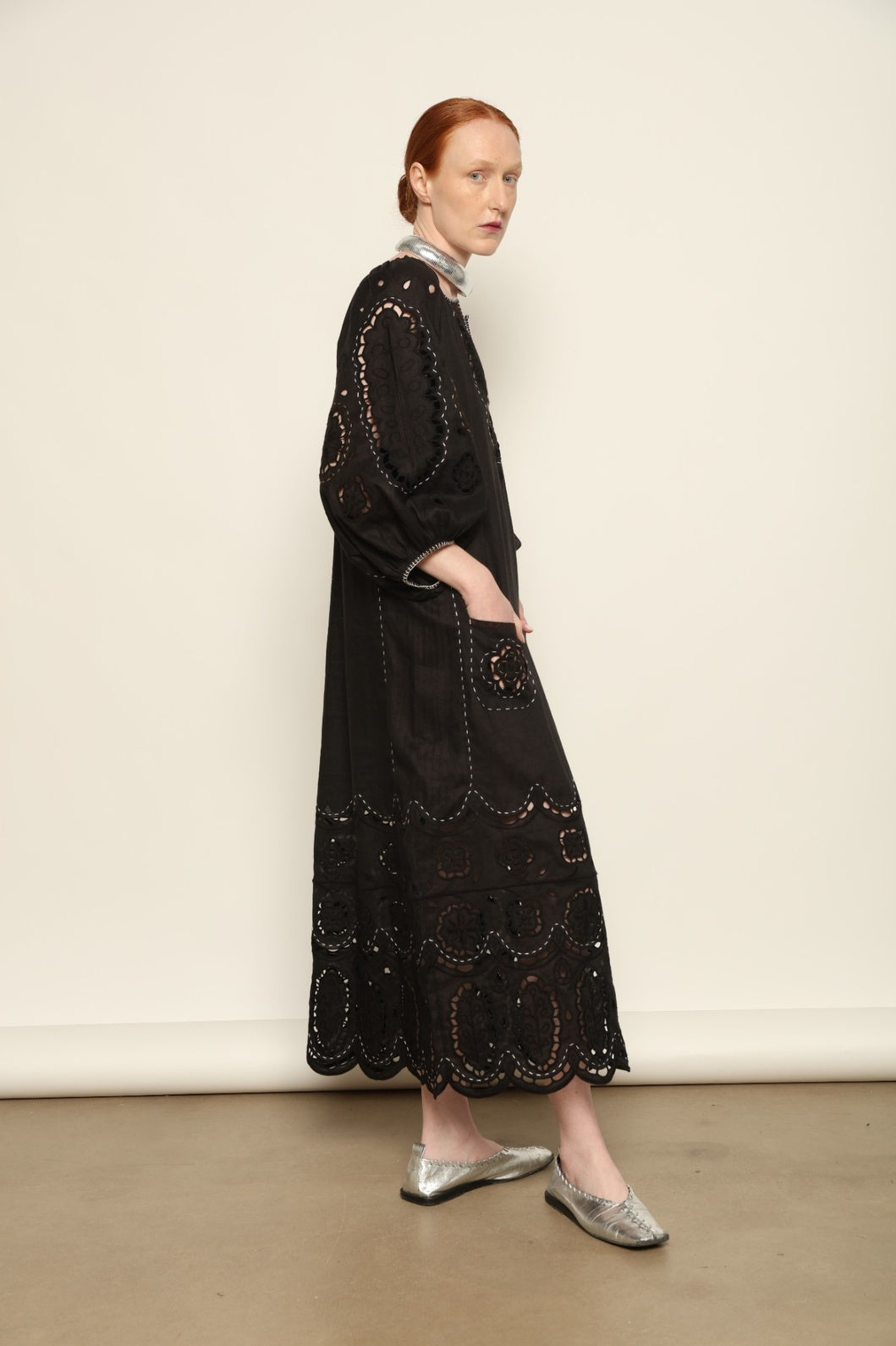 Model is wearing the My Sleeping Gypsy Merezhivo Long Dress, handcrafted from 100% linen with Richelieu embroidery and 24-carat bead accents, from the House of Nomad Stories selection.