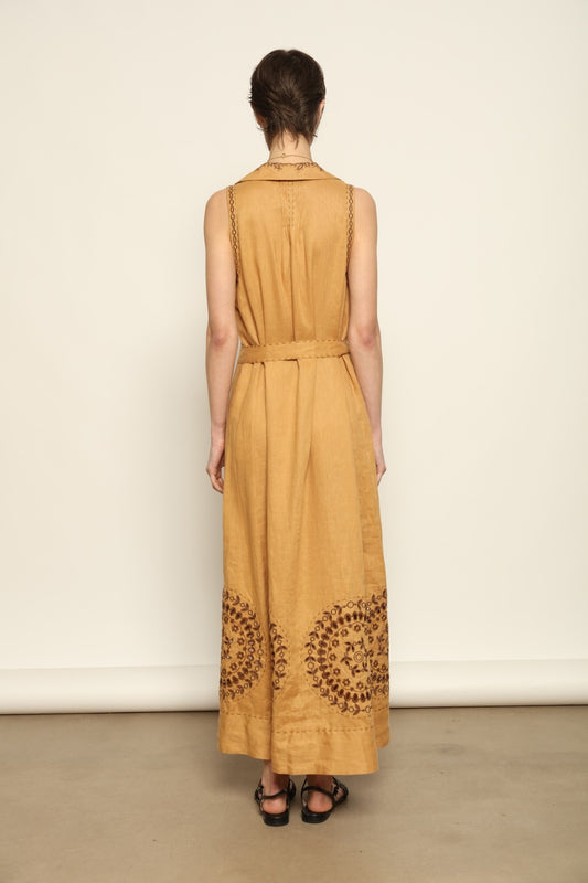 Model is wearing the My Sleeping Gypsy Sarah Long Sleeveless Dress "Merezhivo," handcrafted with Richelieu technique and 24-carat gilded bead detailing, from the House of Nomad Stories selection.