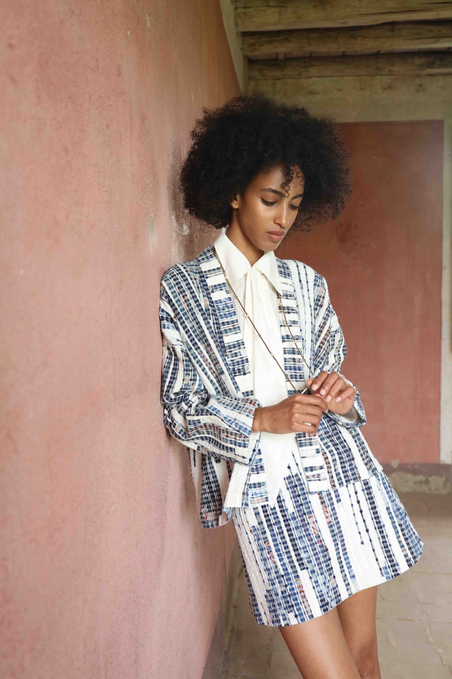 Handwoven from upcycled blue and white fabric waste, this lightweight kimono by Paiwand features a soft, textured finish and celebrates the beauty of conscious craftsmanship and subtle imperfections. Part of House of Woven Stories selection.