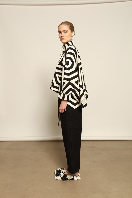 Model wearing Pure Cotton Tantra Black and White Jacket by Ka-Sha, part of the curated House of Woven Stories selection, handcrafted in India from premium cotton with hand-dyed appliqué detailing and a relaxed, artistic silhouette.