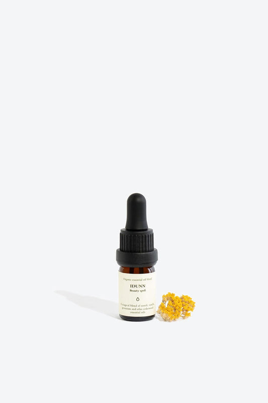 Essential organic oil blend Idunn by Smells Like Spells in amber glass bottle with dropper, natural skincare, Norse goddess of youth inspired fragrance, available at House of Woven Stories.