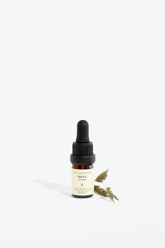 Essential Organic Oil Blend Freya by Smells Like Spells in glass bottle with wooden cap, natural handmade home fragrance for love and passion, available at House of Woven Stories