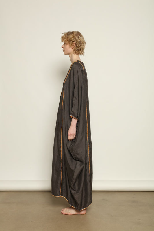 Model is wearing the Thea Grey Silk Dress by Supernaturae x HONS, crafted in handwoven silk from Murshidabad, featuring a relaxed flowing silhouette, elegant open back and natural hand-dyed grey tones. Part of the House of Woven Stories selection